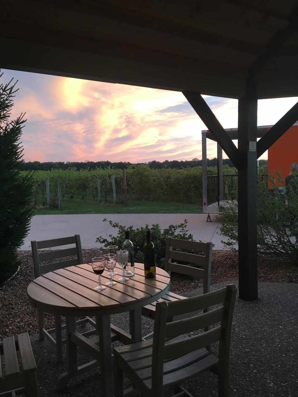 The sun sets among the vineyards of Country Heritage Winery in LaOtto.