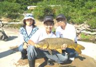 13-year-old Lintaro Kajiwara holds a hefty Oswego River carp as his parents Shiho (left) and Munenori Kajiwara look on. All of the fish caught during that session were released back into the river. Lintaro was fishing with Mike McGrath and Associates in Minetto.