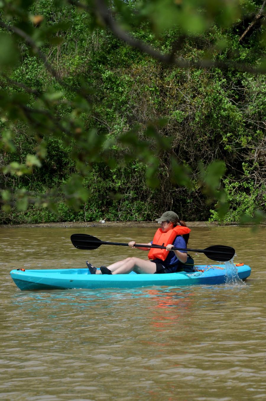 A woman guides her kayak down the Flint River just outside of Huntsville.