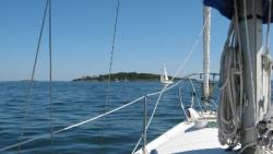 View from sailboat on the water off the coast of Maine