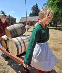 Two young girls at Fort Nisqually dress in period clothing for living history