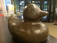 This is a picture of a bronze lucky duck for the Lucky Duck Scavenger Hunt in Huntsville