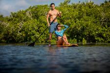 Paddleboarding together is a romantic adventure.