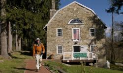 A visitor strolls past the Appalachian Trail Museum along the A.T.