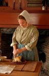 Gwen Miner, Supervisor of Domestic Arts at The Farmers’ Museum, is shown preparing traditional Thanksgiving foods in the Lippitt Farmhouse during the event “Thanksgiving at The Farm,” which takes place the Friday and Saturday after Thanksgiving Day at the museum.