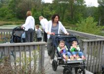 The Nature Strollers enjoy the fields and forest of the Outdoor Discovery Center.