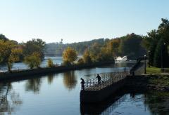 Anglers enjoy a quiet moment along the east side of the Oswego River in downtown Oswego. The river offers plenty of public access for shoreline fishing along its 24-mile course. (Photo by Mary Ellen Barbeau.)