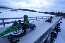 A couple of kids are enjoying a day out snowmobiling in Minocqua.