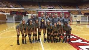 OSU Volleyball team holds NCAA Volleyball Trophy