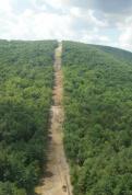 This recent aerial view shows the 46er trails that runs along the new Hudson Chair lift line. This trail was named for the 1946 T-bar that serviced skiers of the Historic North Creek Ski Bowl. The profiles of the trails and lift have retained their original routes, and offer striking new views of North Creek Village and the Hudson River.
