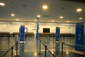 Beautiful artwork is displayed behind the check-in counters at Cruise Terminal 2, which services Princess Cruises