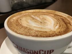 Close-up of a frothy, foamy cup of coffee from Crimson Cup