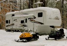 Travel trailer and snowmobiles