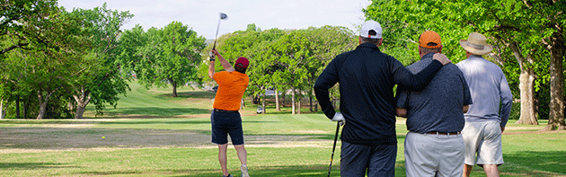 4 men playing golf in OKC
