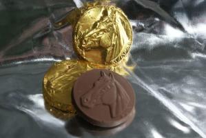 Chocolate Horse Medallion wrapped in gold tin foil from Saratoga Candy Co