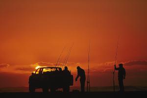 Sunset while driving & fishing on the beach in North Carolina