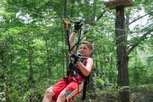 Boy on ZipZone zip line