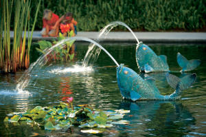 Koi-shaped fountains in a pond at Fashion Island
