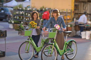 Women Riding GREENbikes with Flowers