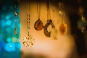Necklaces with pendants hanging on display