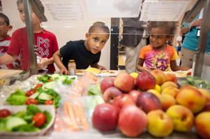 Kids look at healthy food choices