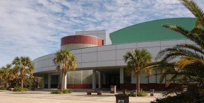 Palm trees line the entrance to Alario Center in Jefferson Parish, Louisiana.