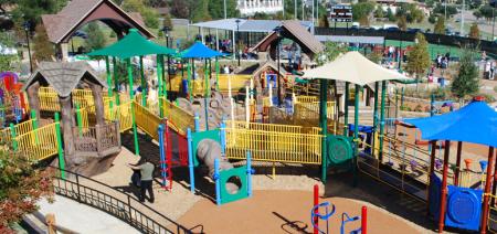 Brightly-colored playground equipment invites children to play at Cottonwood Creek Park.