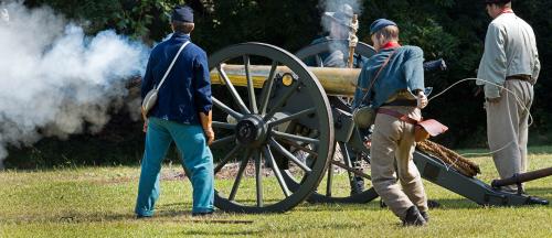 Civil War Reenactors firing a canon at Bentonville Battlefield in Four Oaks, NC