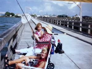 Family fishing on pier in Grand Isle