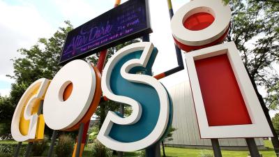 Large, colorful COSI science museum sign