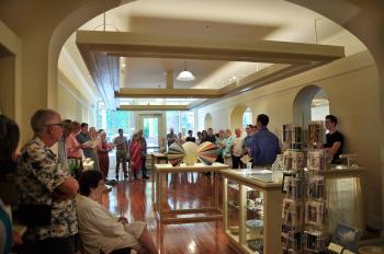 People standing around the Main Street Arts gallery