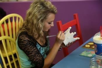 Enjoy a girls night out at uPaint Pottery Studio uPaint Pottery girl painting