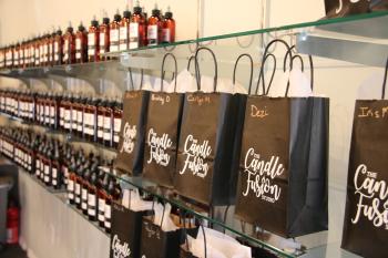 Candle Fusion gift bags hanging on hooks