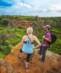 A female and male hiker overlooking Kanopolis State Park from a trail