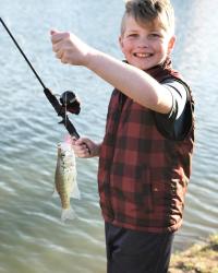 Young Boy With a Fish