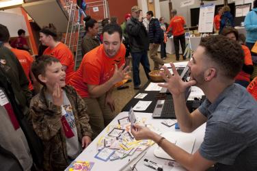 boy learns how to communicate with ASL at Imagine RIT in Rochester, NY