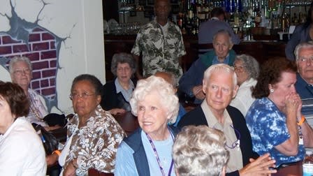 A group enjoys an SCVB wine reception at their hotel.