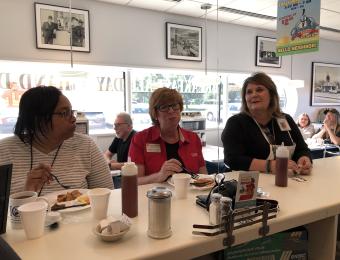 North-ladies at counter Visit Wichita