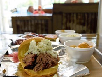 Redneck BBQ sandwich with slaw and side of potatoes, Benson, NC.