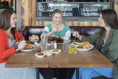 Friends dining on the Four Season Porch