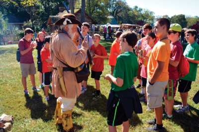 A historical reenactor teaches history to a group of kids in Knoxville, TN