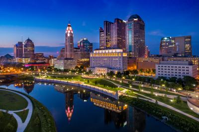 Lit-up Columbus Skyline at night on Scioto riverfront downtown