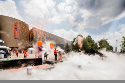 Fog machines, balloons streamers, and celebrating on stage outside COSI at the Big Science Celebration