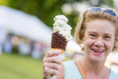 A visitor enjoys an ice cream cone at Wilmington's annual Ice Cream Festival.