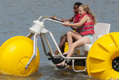 Kids riding on a water trike