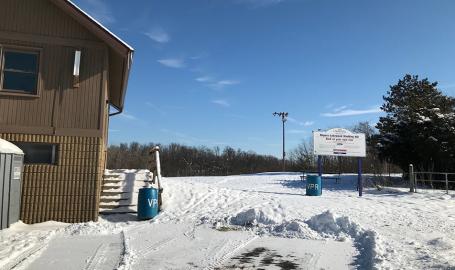 Rogers Lakewood Park sledding hill building and sign