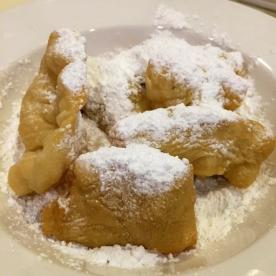 Pastries topped with powdered sugar from Creole Kitchen