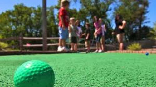 Family Playing At Hazzards Miniature Golf In Dayton, Ohio