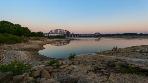 Bridge In The Distance Of Falls of the Ohio At Dusk