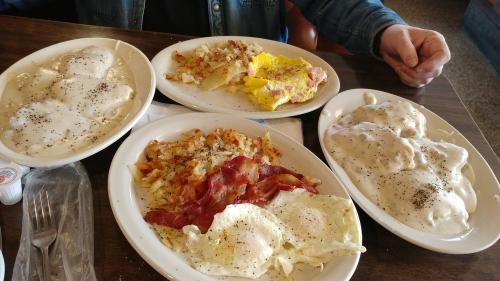 Four plates with eggs and hash browns at Hasty Tasty Pancake House in Dayton, OH